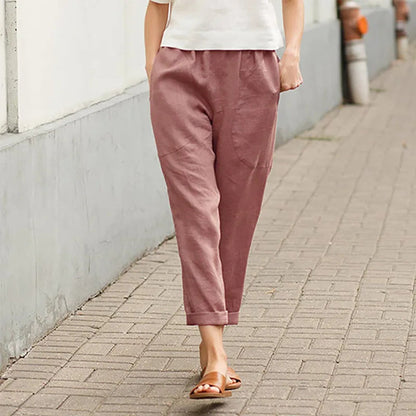 Pantalon ample rose avec poches, taille élastique, bas légèrement resserré