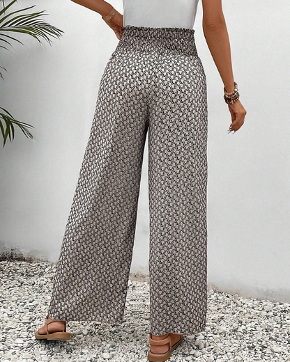 Pantalon ample à taille élastique, imprimé géométrique gris foncé et clair.