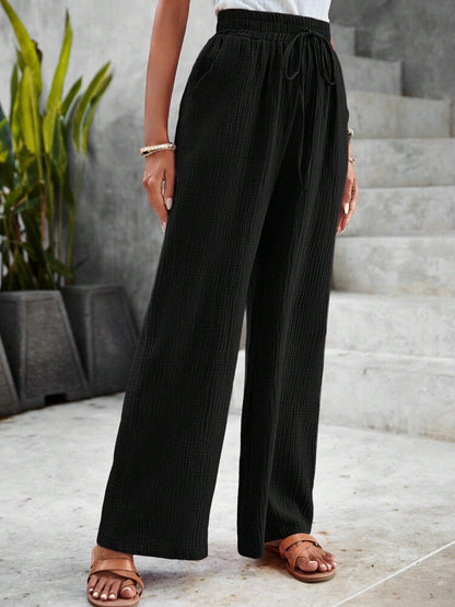 Pantalon ample noir à taille élastique avec cordon, jambes droites et fluides