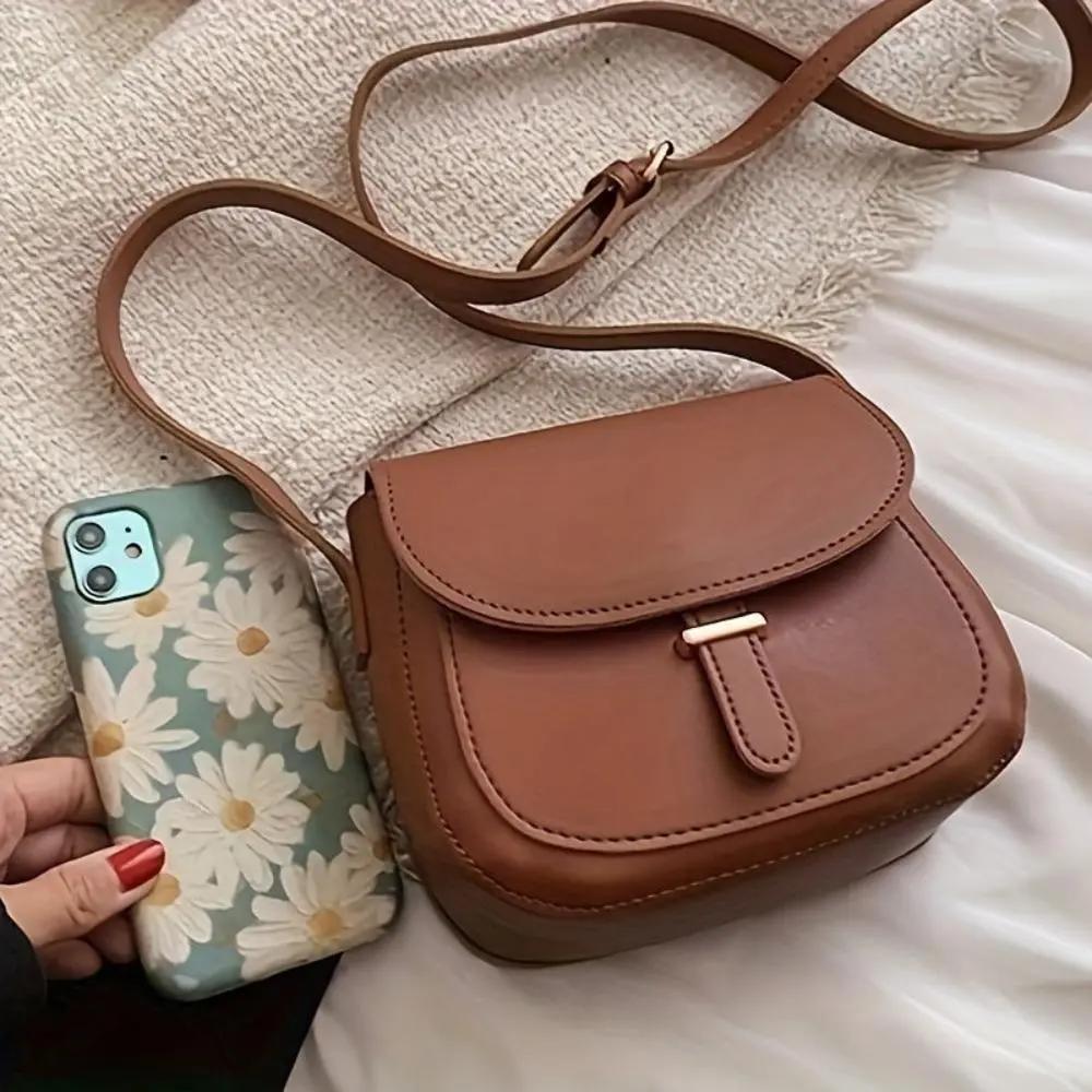 Sacoche de selle vintage marron, rabat à boucle, bandoulière réglable