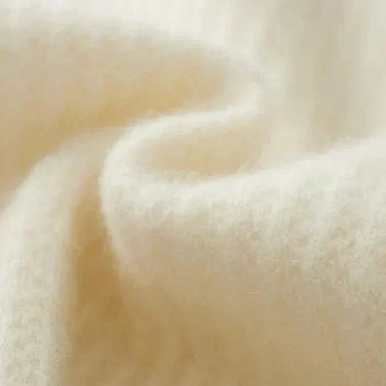 Texture en cachemire beige, maille fine avec relief régulier.