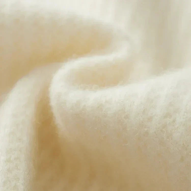 Cachemire beige texturé, gros plan de la maille.