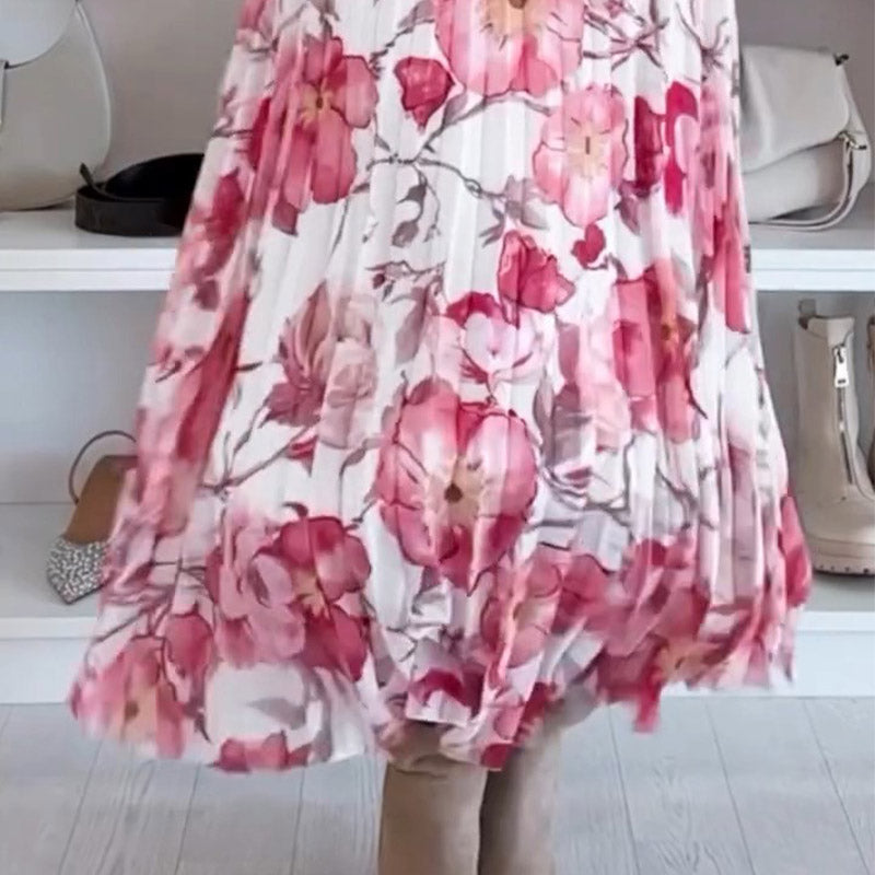Robe mi-longue à fleurs roses, encolure épaules dénudées, manches bouffantes