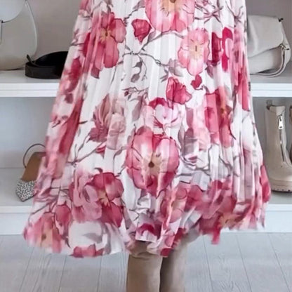 Robe mi-longue à fleurs roses, encolure épaules dénudées, manches bouffantes