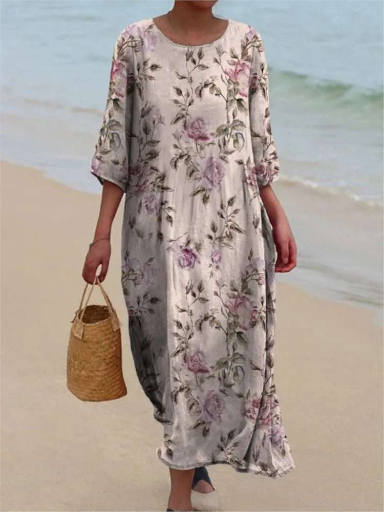 Robe vintage longue à fleurs crème, encolure ronde, manches trois-quarts.