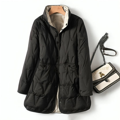 Manteau matelassé noir, col montant, fermeture boutonnée, manches longues