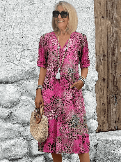 Robe d’été rose à col V boutonné, motif tacheté, manches courtes et pompons