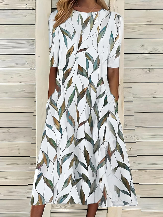 Robe mi-longue blanche à col carré, manches courtes, motif feuilles vertes