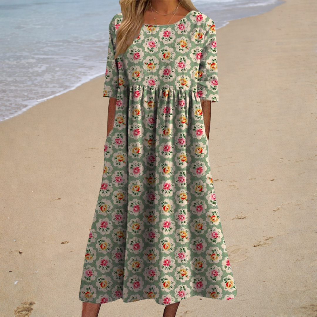 Robe midi à manches courtes, imprimé fleurs multicolores, fond vert-gris.