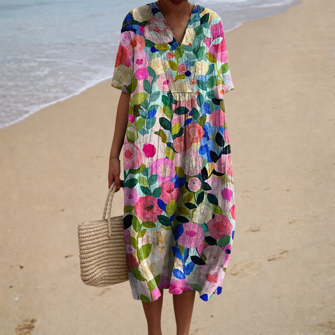Robe longue Célestine florale multicolore, encolure V, manches courtes, coupe ample.