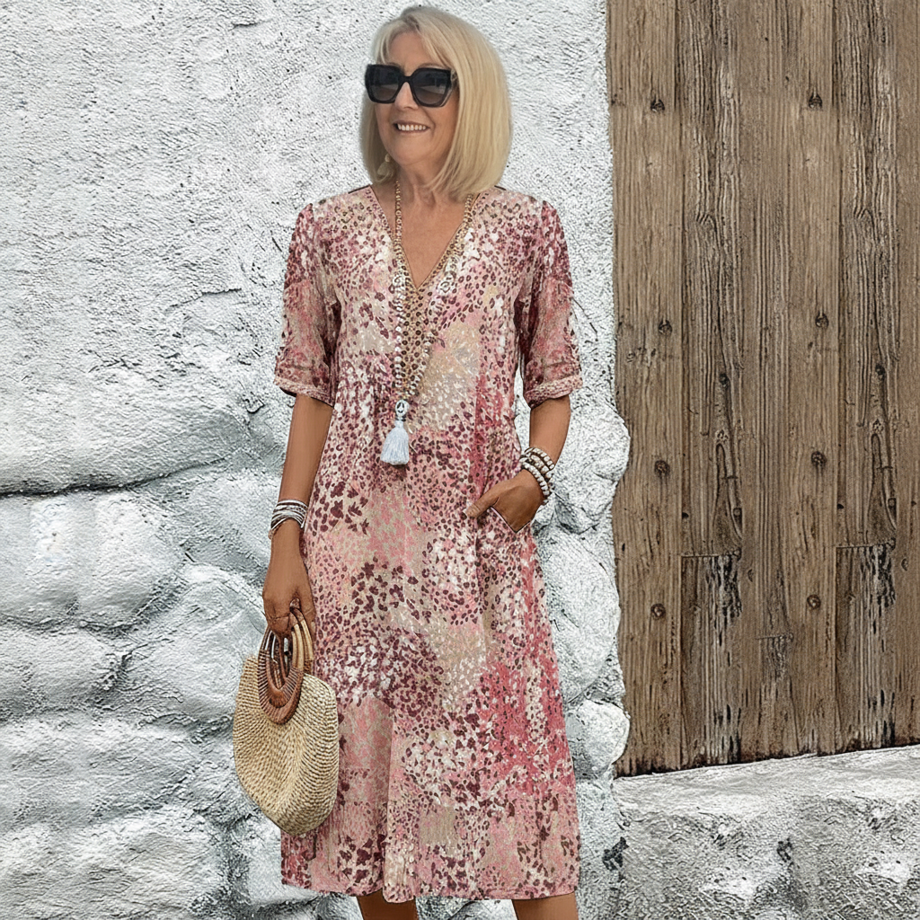 Robe midi imprimée rose/beige, col V, manches trois-quarts, motifs épars.