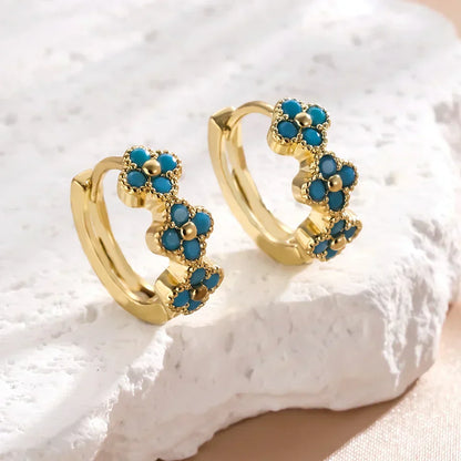 Paire de créoles dorées ornées de fleurs turquoise en relief