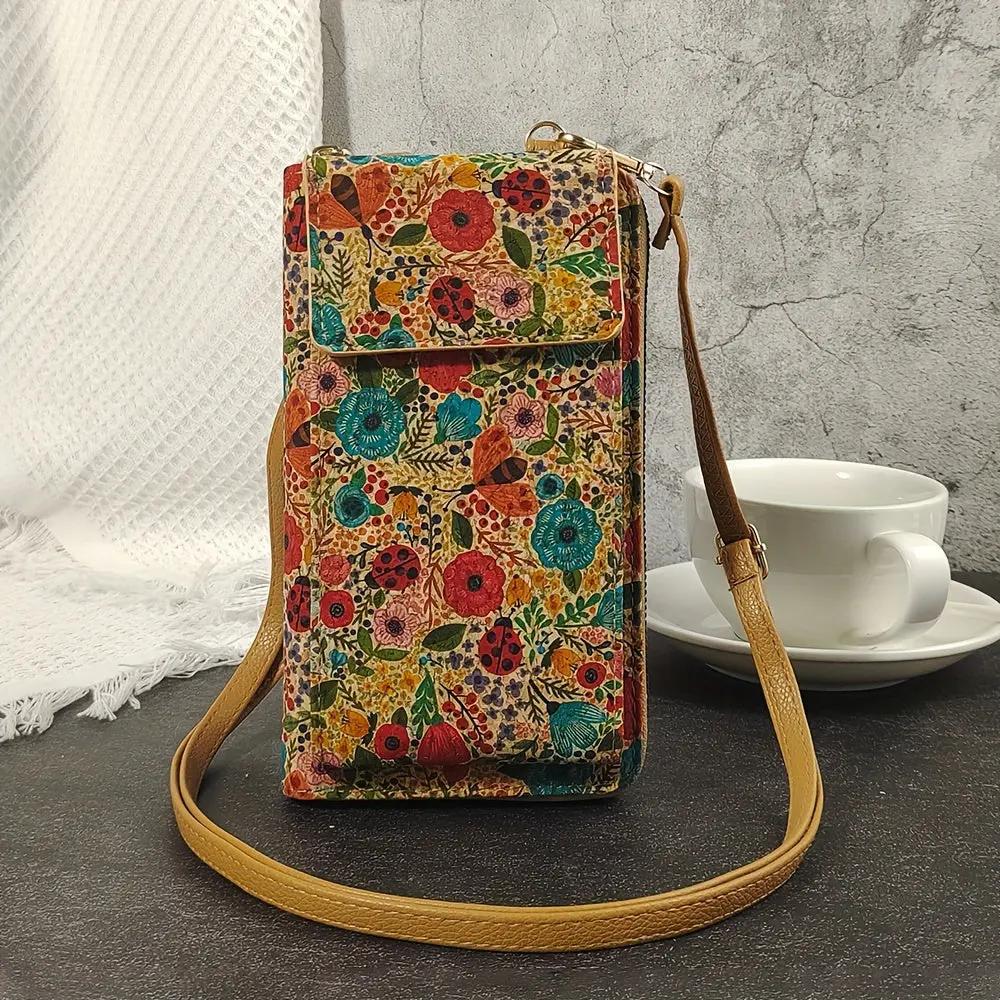 Sac bandoulière bohème rectangulaire, motif fleurs multicolores, rabat avec boucle.