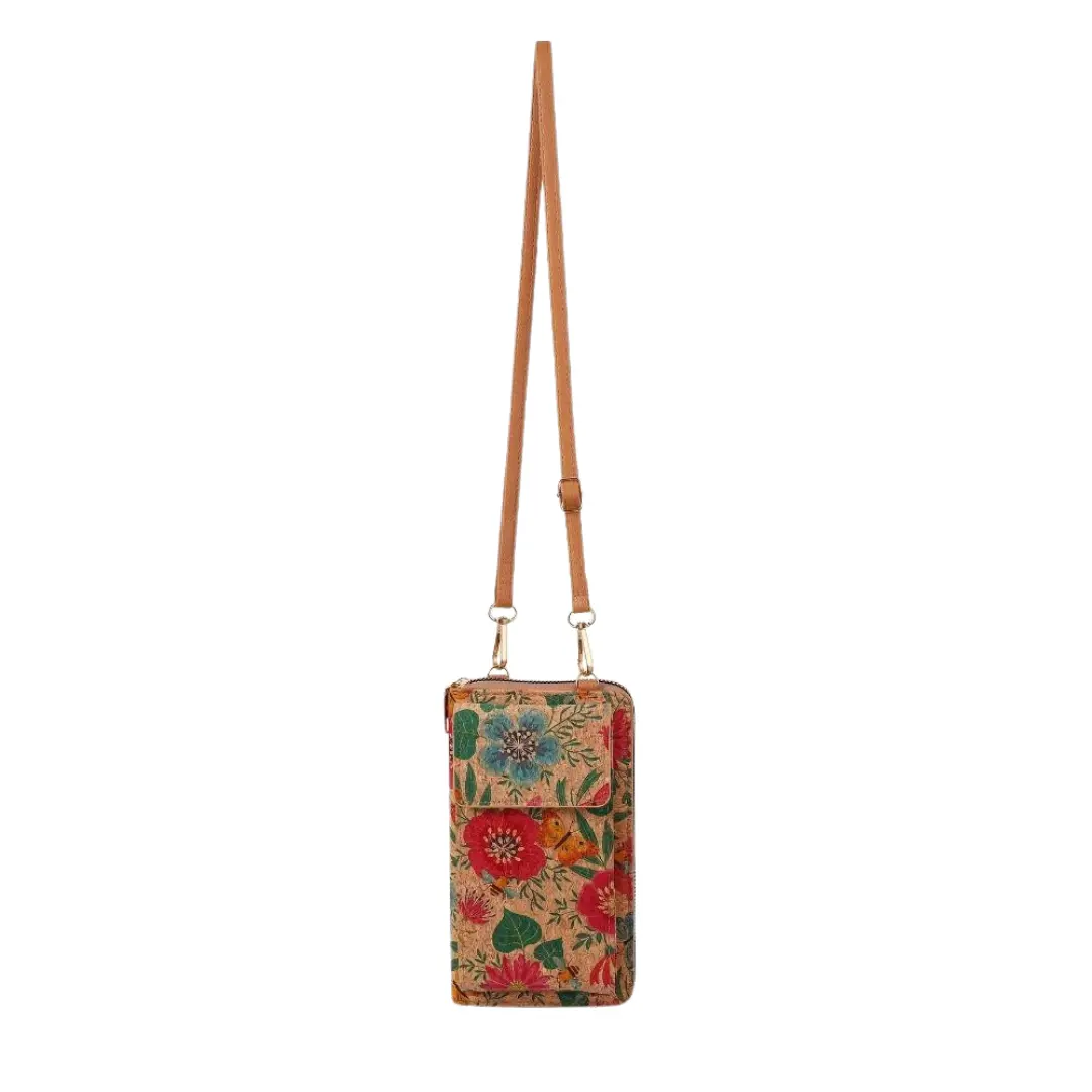 Petit sac bandoulière en tissu à fleurs, porté par deux anses en cuir
