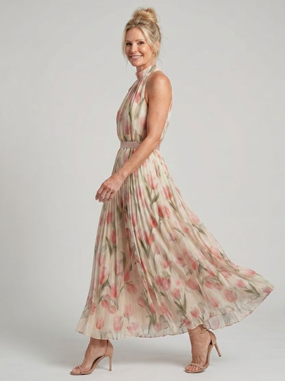 Robe midi fleurie à col montant, sans manches, jupe évasée et plis le long de la robe