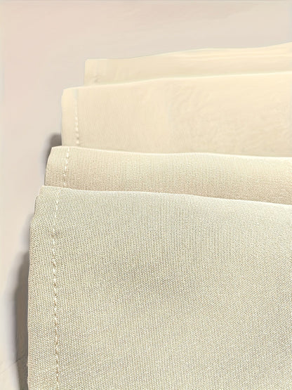 Échantillons de tissu beige clair, bord surpiqué et texture tissée