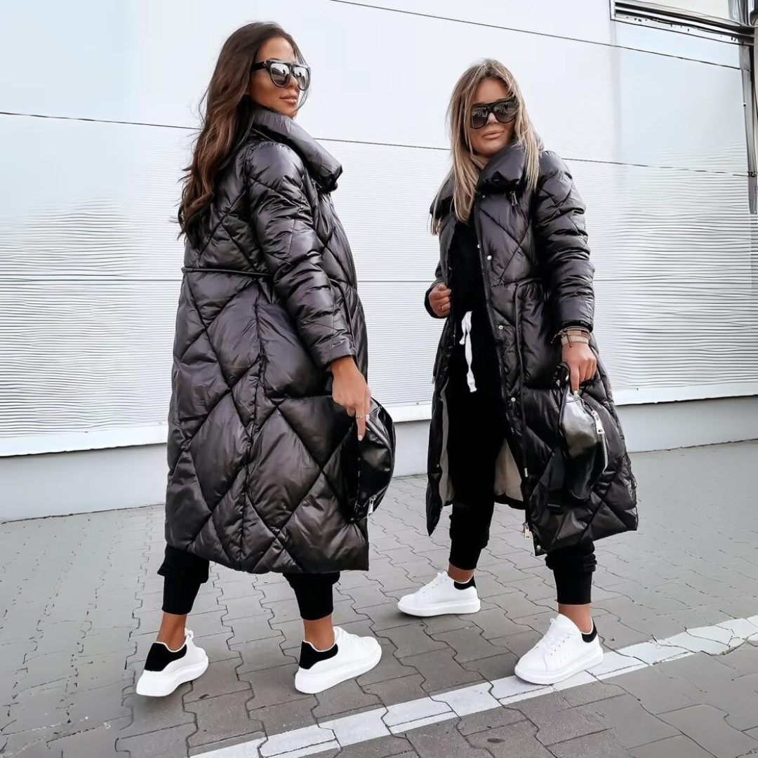 Manteau long matelassé noir, col montant, fermeture zippée et poches latérales