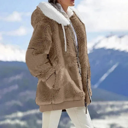 Veste d’hiver en fausse fourrure beige, col et capuche blanc, fermeture zippée.