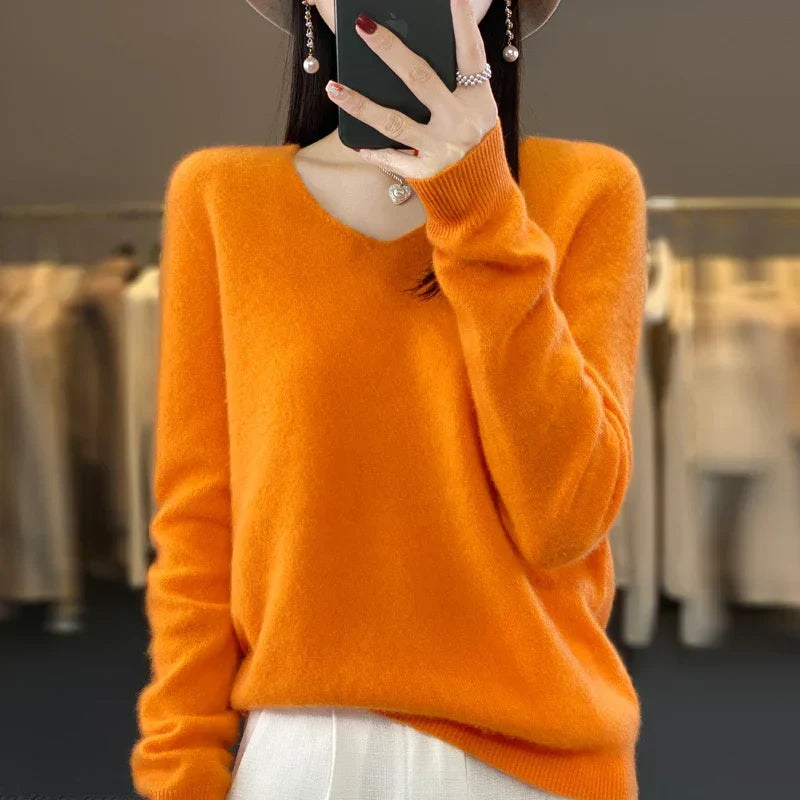 Pull en cachemire élégant orange, encolure ras du cou et manches longues
