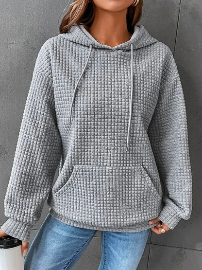 Sweat-shirt à capuche gris clair en tissu texturé, poche kangourou et cordons