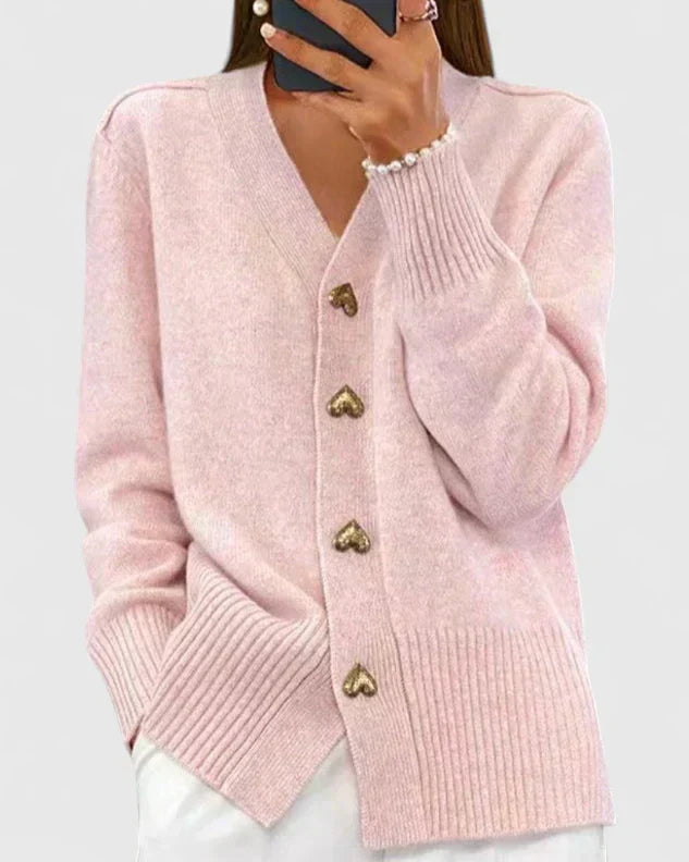 Pull-gilet en maille rose, col V et boutons dorés, manches longues, poignets côtelés