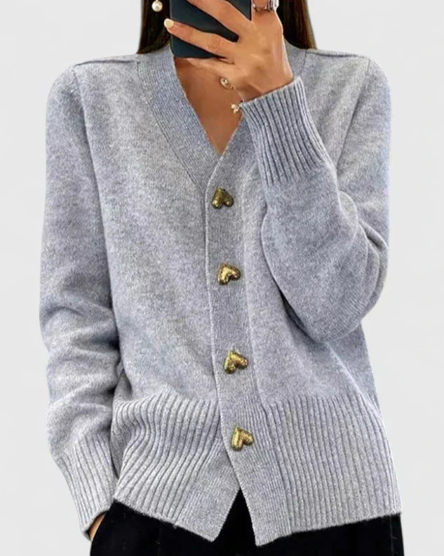 Pull-gilet en maille gris, col V et boutons dorés, manches longues, bas côtelé