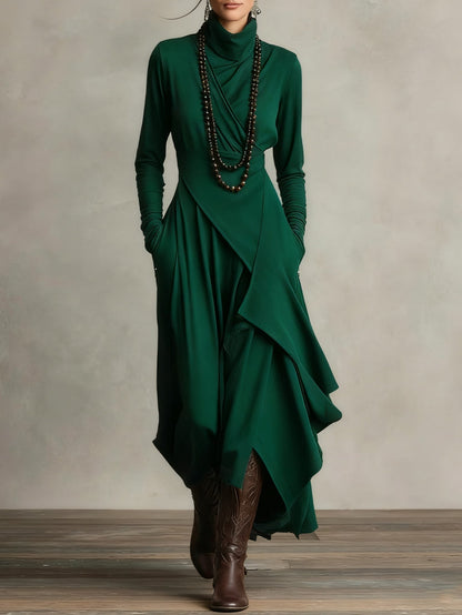 Robe en laine verte à manches longues, décolleté en V et ourlet asymétrique drapé