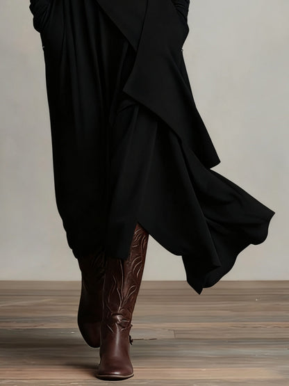 Robe en laine noire à pan drapé croisé, ourlet asymétrique, manches longues