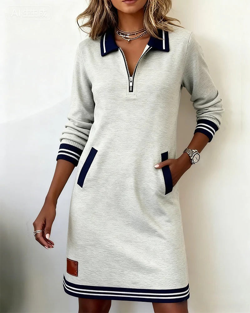 Robe gris clair à manches longues, fermeture éclair courte et poches plaquées