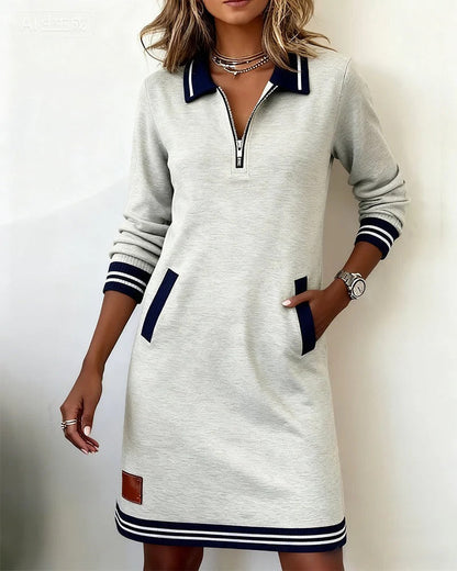 Robe gris clair à manches longues, fermeture éclair courte et poches plaquées