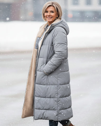 Manteau réversible matelassé à capuche, face extérieure gris, doublure beige en fausse fourrure.