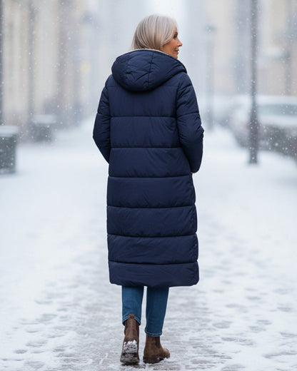 Manteau réversible dos en doudoune bleu marine, capuche doublée sherpa beige.