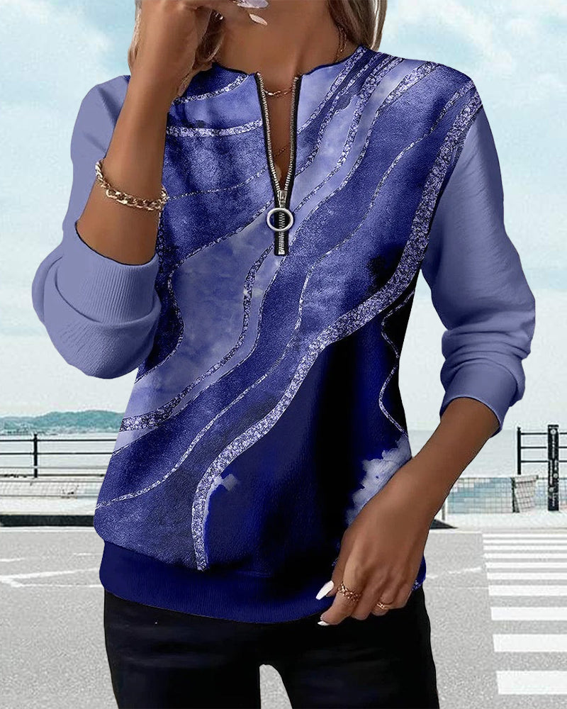 Sweat-shirt bleu à rayures effet strié, manches longues et zip central.