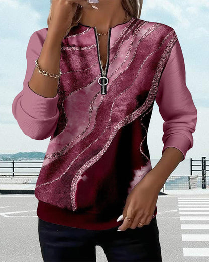 Sweat-shirt bordeaux à rayures effet strié, zip central et col ouvert.