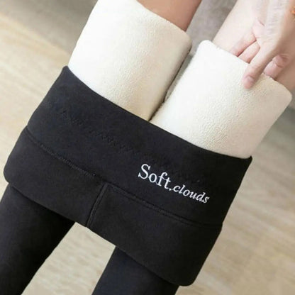 Pantalon d’hiver noir à taille haute, intérieur doublé, coupe près du corps.