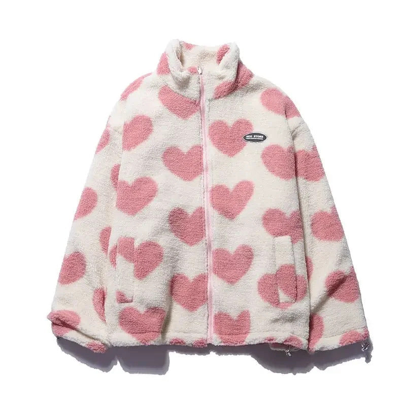 Veste réversible enfant en polaire ivoire à cœurs roses, capuche et zip.
