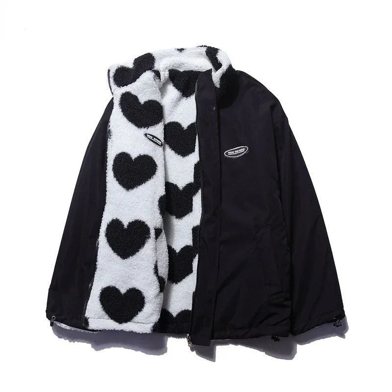 Veste réversible enfant noire et blanche à cœurs, capuche et fermeture zippée.