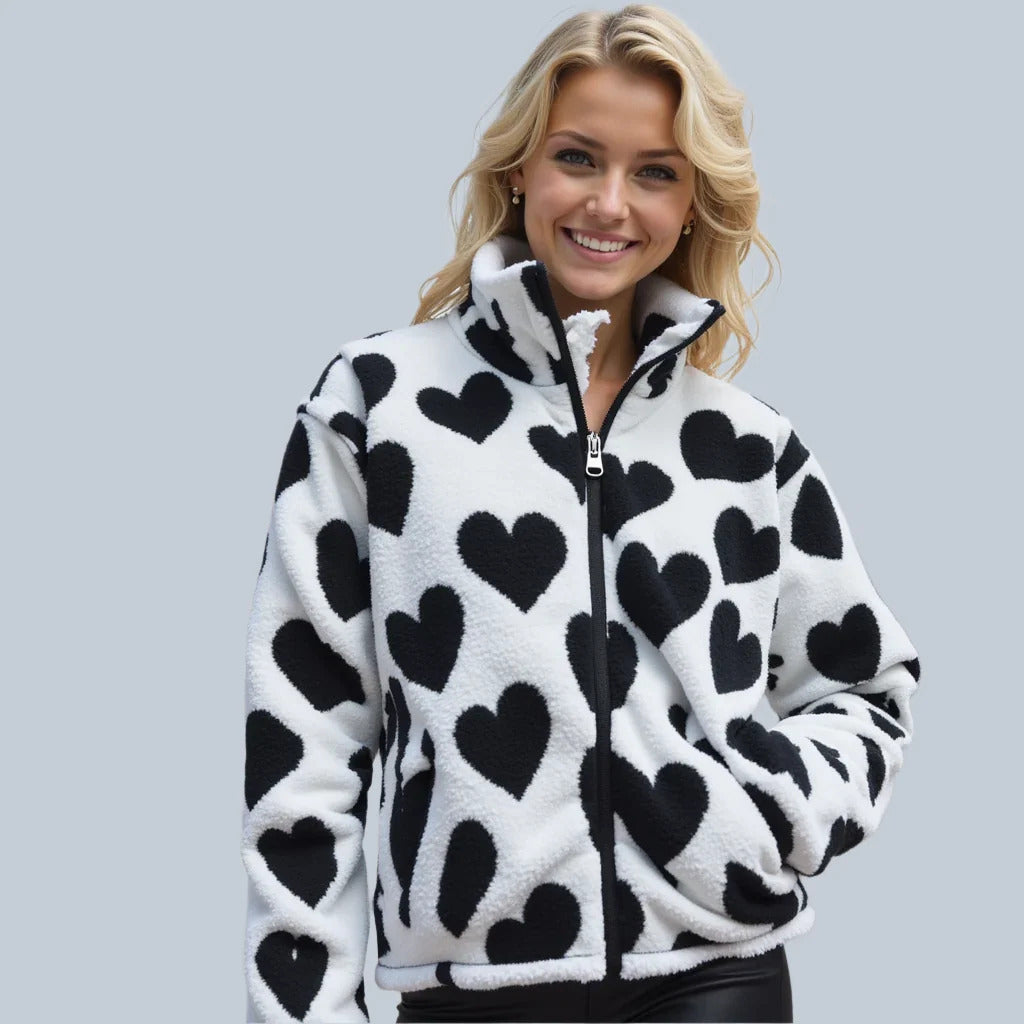 Veste réversible à cœurs : polaire blanche avec cœurs noirs, fermeture zippée