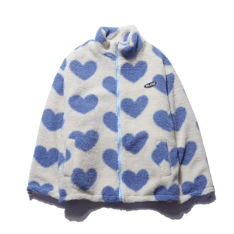 Veste réversible enfant en polaire écrue à cœurs bleus, capuche et zip.