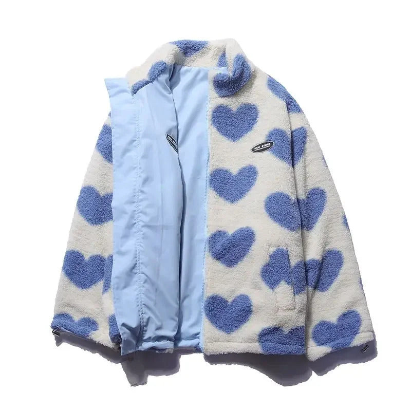 Veste réversible enfant bleu clair et polaire écrue à cœurs bleus, zip et capuche.