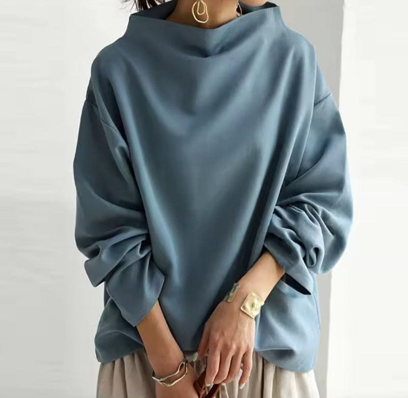 Haut bleu ample à col cheminée et manches bouffantes, style chic décontracté