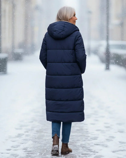 Manteau long matelassé réversible bleu marine, vue de dos à capuche.