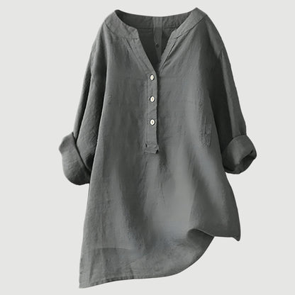 Chemise ample en lin gris, encolure en V, patte boutonnée, manches larges.