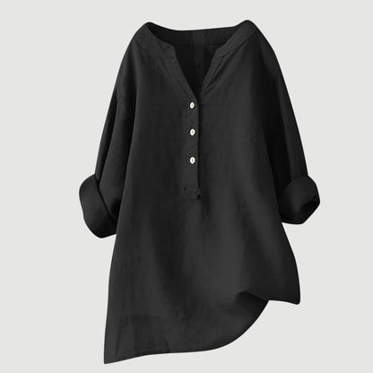 Chemise ample en lin noir, encolure en V, patte boutonnée, manches larges.