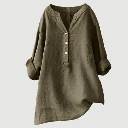 Chemise ample en lin vert foncé, encolure en V, patte boutonnée, manches larges.