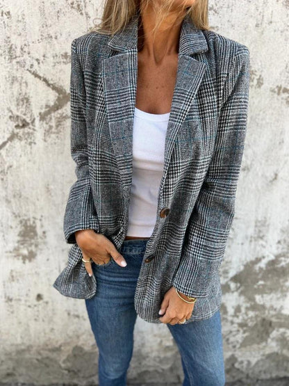 Manteau à carreaux gris et bleu marine, col tailleur, manches longues, poches latérales.