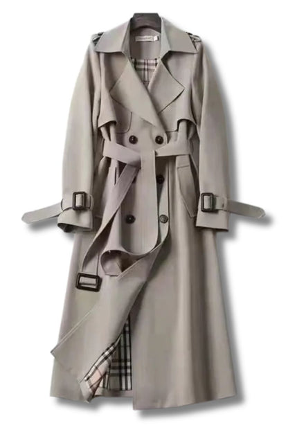 Trench-coat beige clair avec col pointu, ceinture à boucles et boutons, doublure à carreaux.