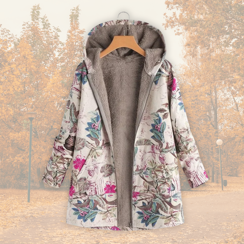 Veste à capuche doublée polaire, tissu écru à fleurs multicolores, fermeture zippée.