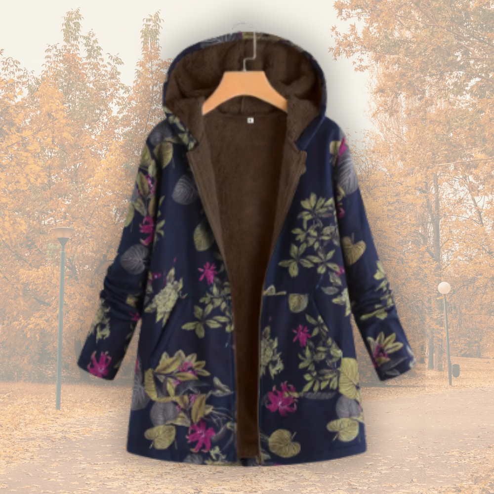 Veste à capuche doublée polaire, tissu bleu foncé fleuri multicolore, fermeture zippée.