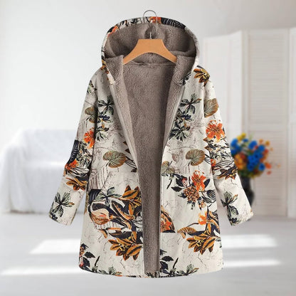 Veste à capuche doublée polaire, imprimé végétal sur fond clair, fermeture zippée.